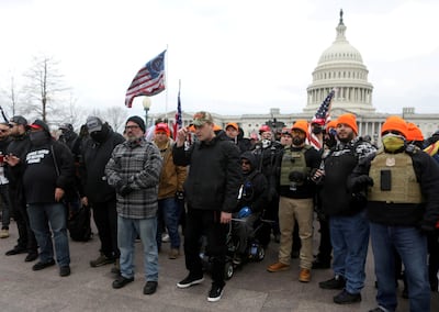 FILE PHOTO: Proud Boys member Joe Biggs (front row second from left in grey plaid shirt) poses with other members before he was later arrested for involvement in the storming of the U.S. Capitol building in Washington. D.C., U.S. Picture taken January 6, 2021. REUTERS/Jim Urquhart/File Photo