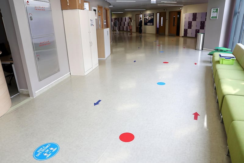 DUBAI, UNITED ARAB EMIRATES , August 10 – 2020 :-  Social distancing stickers pasted on the floor at the Dubai American Academy in Dubai. New Covid safety setup in different areas of the school such as hand sanitizer, safety message, social distancing stickers pasted on the floor, thermal cameras will be installed at the entrance of the school. School will open on 30th August. (Pawan Singh / The National) For News/Online/Instagram. Story by Sarwat Nasir