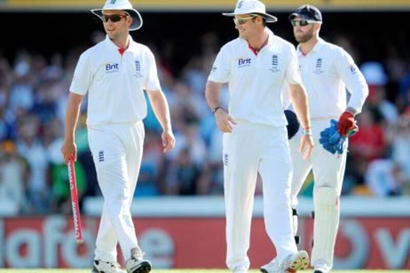 England captain Andrew Strauss (C) and teammates Jonathan Trott (L) and Matt Prior (R) smile as they walk off after drawing the match on the final day of the first Ashes cricket Test match in Brisbane on November 29, 2010.  IMAGE STRICTLY RESTRICTED TO EDITORIAL USE – STRICTLY NO COMMERCIAL USE  AFP PHOTO/William WEST
 *** Local Caption ***  765463-01-08.jpg