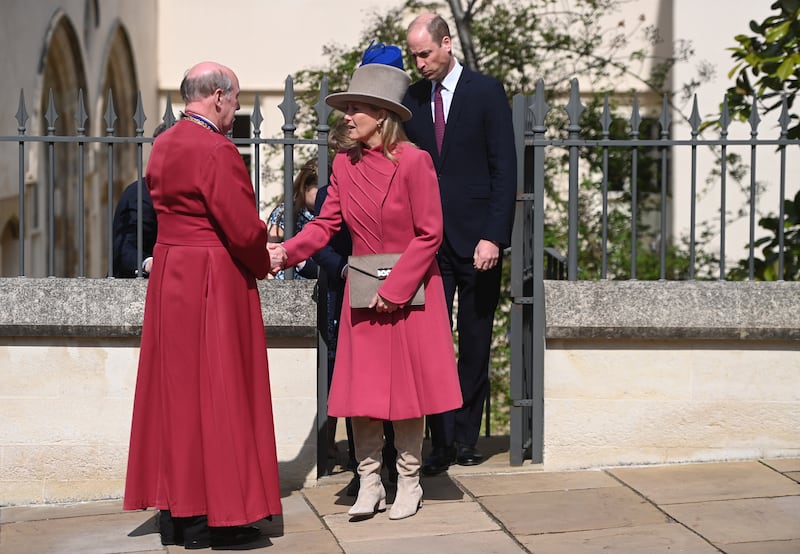 The duchess, in a pink Catherine Walker coat and cream knee-high boots, and Prince Edward depart the Easter Sunday service at St Georges Chapel at Windsor Castle in April 2023. EPA