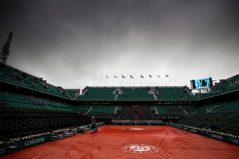 Heavy rain delays the start of the day’s play on Day 10 of the 2016 French Open at Roland Garros. Clive Brunskill / Getty Images