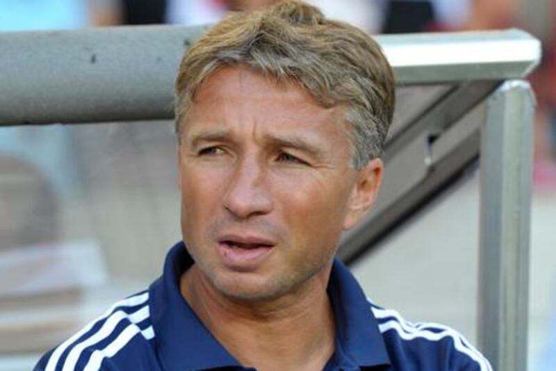 Dinamo Moscow's Romanian headcoach Dan Petrescu waits for the start of the UEFA Europa League play-off round first leg match between VfB Stuttgart and Dinamo Moscow at the Mercedes-Benz Arena stadium in Stuttgart, southwestern Germany, on August 22, 2012. Stuttgart won the match 2-0.    AFP PHOTO / THOMAS KIENZLE