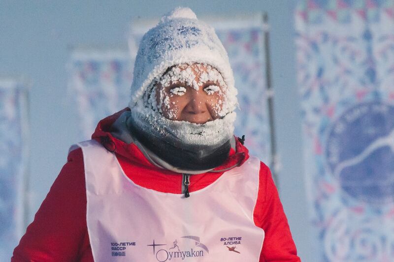 A runner takes part in the International World's coldest marathon at minus 53 degrees (-63. 4 Fahrenheit) near Oymyakon, the republic of Sakha, also known as Yakutia, Russian Far East, Saturday, Jan.  22, 2022.  Sixty five runners, including sportsmen from the United Arab Emirates, United States and Belarus, started the run at extremely low temperature in Oymyakon, Yakutia's Pole of Cold.  The international team of men and women ran full distance and half-marathon.  (AP Photo / Ivan Nikiforov)