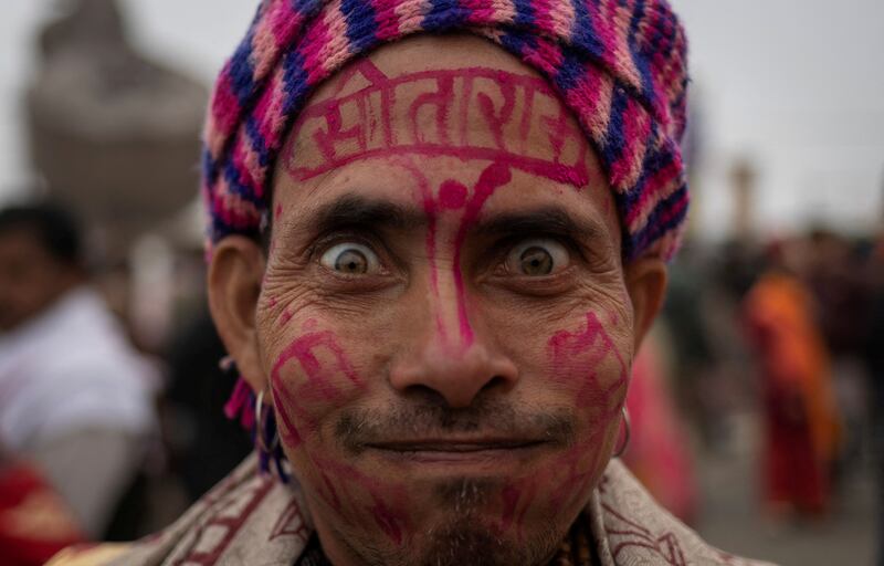 A Hindu devotee arrives ahead of the opening of the grand temple of Lord Ram in Ayodhya, northern Uttar Pradesh, India. Reuters