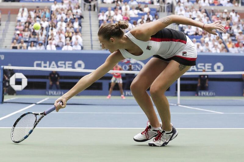 Karolina Pliskova of the Czech Republic hits a return to Angelique Kerber. Jason Szenes / EPA