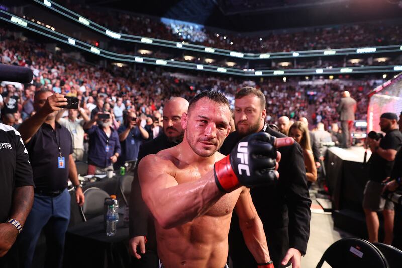 Michael Chandler celebrates his knockout victory against Tony Ferguson at UFC 274. Reuters