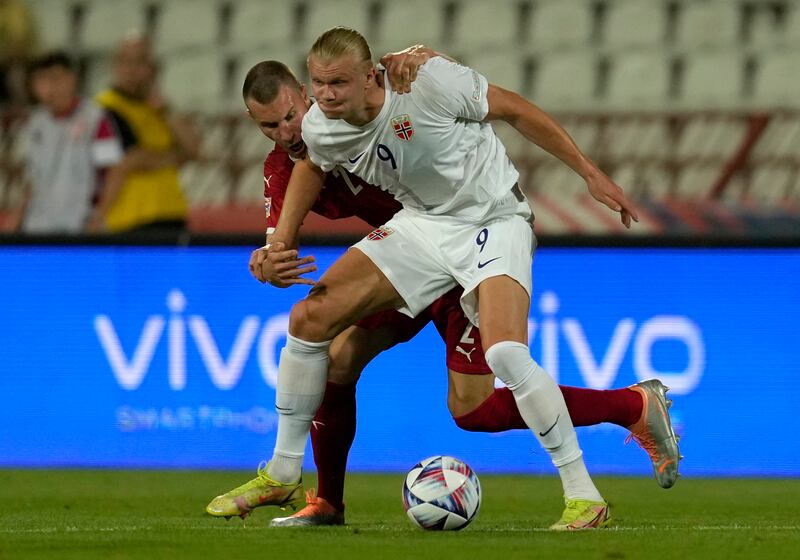 Norway's Erling Haaland, front, duels for the ball with Serbia's Strahinja Pavlovic. AP Photo 