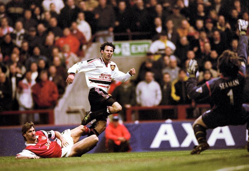 14 Apr 1999:  Ryan Giggs of Manchester United beats the despairing lunge of Tony Adams of Arsenal to drive the ball past David Seaman to score the winner in the FA Cup Semi Final match played at Villa Park in Birmingham. Manchester United won the game 2-1 after extra-time. \ Mandatory Credit: Shaun Botterill /Allsport