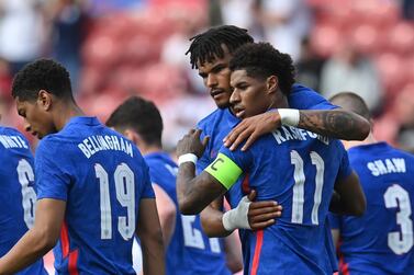 England's Marcus Rashford celebrates after scoring his side's first goal during the international friendly soccer match between England and Romania in Middlesbrough, England, Sunday, June 6, 2021. (Paul Ellis, Pool via AP)