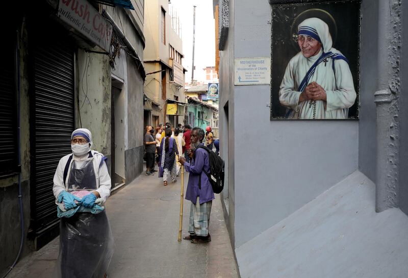 People pray at Mother Teresa's Mother House on Good Friday in Kolkata, eastern India. EPA
