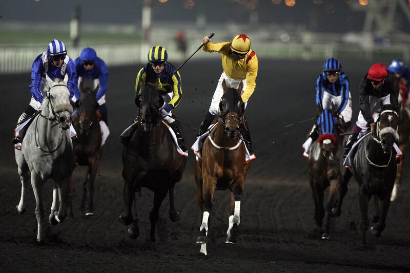 March 30, 2013 (Dubai) Jockey Richard Mullen (5) in Yellow riding Reynaldo The Wizard owned by Zabeel Racing International, Corp wins the Dubai Golden Shaheen at the Dubai World Cup March 30, 2013. (Sammy Dallal / The National)