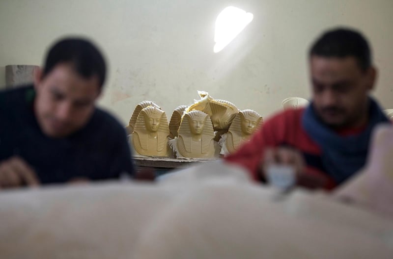 Artists work near replicas of Pharaonic statues at the Replica Production Unit located at Salah Al Din Citadel in Cairo, Egypt. EPA