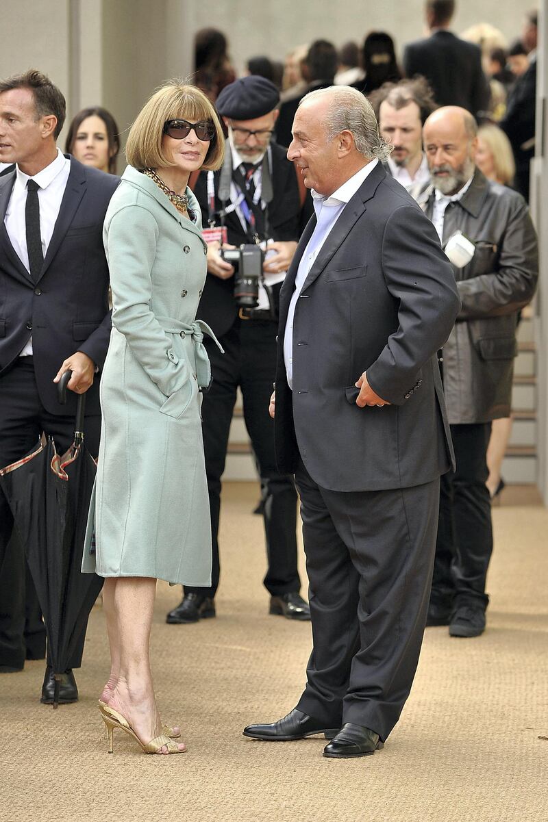 LONDON, ENGLAND - SEPTEMBER 16:  Anna Wintour and Philip Green arrive at Burberry Prorsum Womenswear Spring/Summer 2014 show during London Fashion Week at Kensington Gardens on September 16, 2013 in London, England.  (Photo by Gareth Cattermole/Getty Images for Burberry)