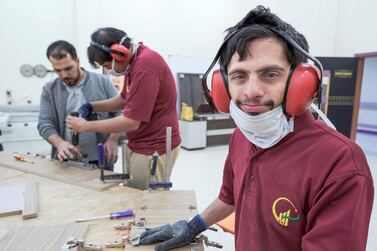 Omar Al Marzooqi at work in the Bani Yas workshop. Victor Besa / The National 