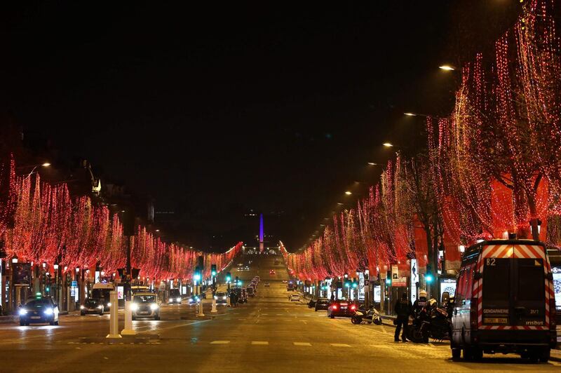 Police officers control drivers in central Paris where there is an 8:00 pm-6:00 am curfew. AFP