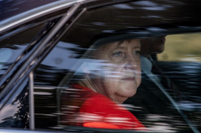 epa06898277 German Chancellor Angela Merkel leaves a farm in her car in Nienborstel, Germany, 19 July 2018. Chancellor Merkel visited the farm following an invitation personally addressed to her the by Ursula Trede nine months ago, in the 'ARD' election arena before the federal election, media reported.  EPA/DAVID HECKER