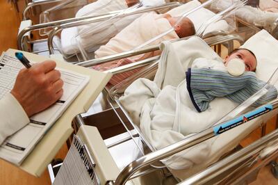 FILE - This Feb. 16, 2017 file photo shows newborn babies in the nursery of a postpartum recovery center in upstate New York. According to a government report released Wednesday, May 15, 2019, U.S. birth rates reached record lows for women in their teens and 20s, leading to the fewest babies in 32 years. (AP Photo/Seth Wenig, File)