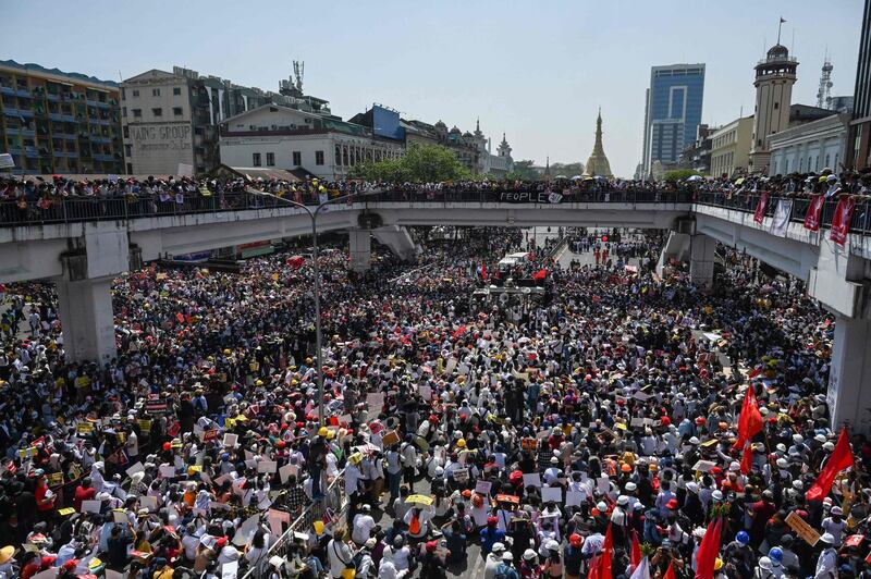 Protesters block a major road in Yangon during a demonstration against the military coup in Myanmar. AFP
