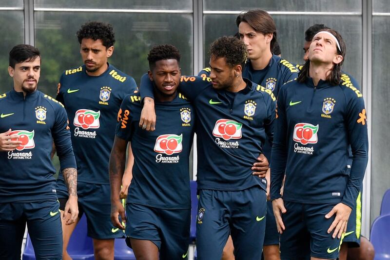 epa06787246 Brazil's Fred (C-L) and Neymar (C-R) embrace during a training session at Tottenham Hotspur's training complex in Enfield, north London, Britain, 05 June 2018. Brazil's national team prepares for the FIFA World Cup 2018 taking place in Russia from 14 June to 15 July 2018.  EPA/WILL OLIVER