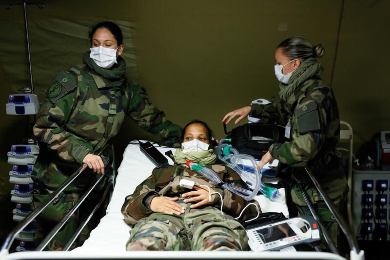 epa08318240 Military exercises before receiving coronavirus patients at a military field hospital at the Emile Muller Hospital in Mulhouse, France, 24 March 2020, on the fifth day of a strict lockdown in France to stop the spread of coronavirus and COVID-19 disease.  EPA/CUGNOT MATHIEU / POOL