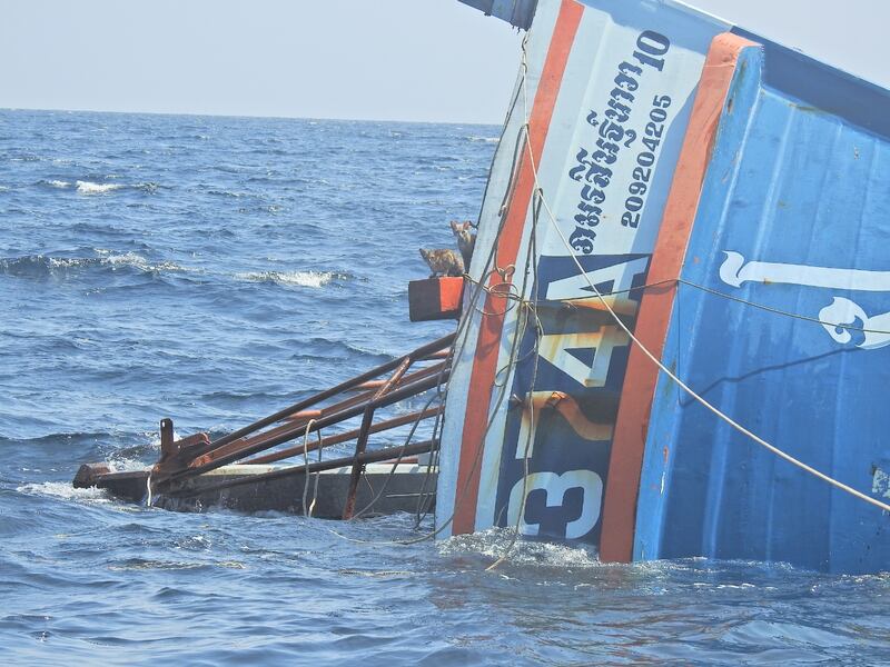 Cats look out from a sinking boat in the Andaman Sea March 2, 2021 in this picture obtained from social media. PO1 WICHIT PUKDEELON via REUTERS THIS IMAGE HAS BEEN SUPPLIED BY A THIRD PARTY. MANDATORY CREDIT. NO RESALES. NO ARCHIVES.