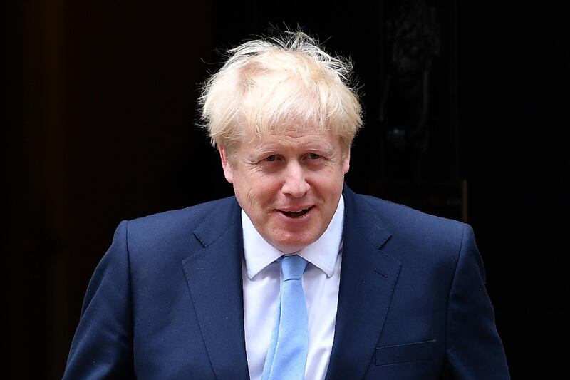 (FILES) In this file photo taken on August 07, 2019 Britain's Prime Minister Boris Johnson prepares to greet King Abdullah II of Jordan outside 10 Downing Street in London on August 7, 2019, ahead of bilateral talks and a working lunch. Prime Minister Boris Johnson makes his debut on the global stage at the G7 summit this weekend, August 24, 2019, where all eyes will be on his chumminess with US President Donald Trump.
 / AFP / Daniel LEAL-OLIVAS
