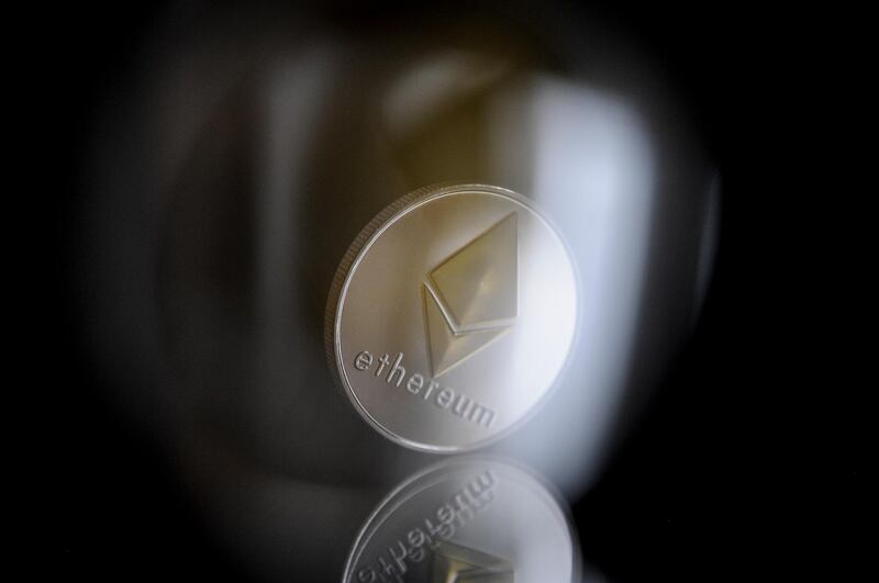 A replica &quot;ether&quot; cryptocurrency coin in seen in this photo illustration on November 8, 2017. Ether is a token in a distributed network computing system named Ethereum which allows the cryptocurrency to be used and traded. (Photo by Jaap Arriens/Sipa USA) (Photo by Jaap Arriens/NurPhoto via Getty Images)