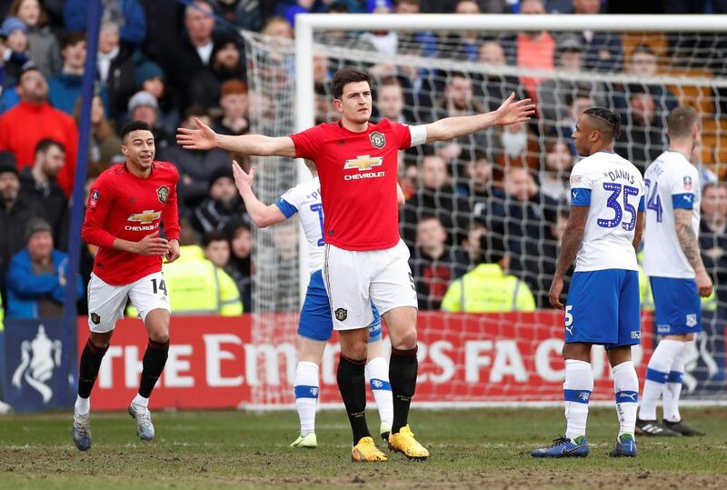 Manchester United's Harry Maguire celebrates scoring their first goal. Reuters