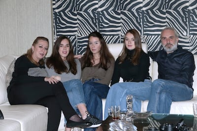 Lebanese Nayla Itani (L), her Syrian husband Mohammad Smouneh (R) and their three daughters (C) pose for a picture at their home in Beirut, Lebanon, 14 January 2020.  Due to the fact that Nayla Itani Smouneh is married to the Syrian national Mohammad Smouneh, her children are not considered Lebanese even though they were born in Lebanon, have lived there all their lives, and have a Lebanese mother. Because of that, they had a hard time finding employment. They now have jobs, but their employer only pays them under the table. Furthermore, growing xenophobia in the country has been weighing on them.