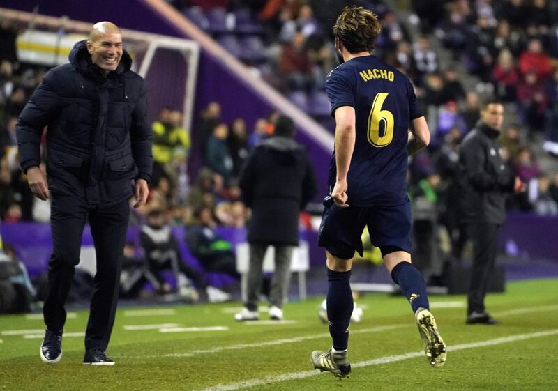 Nacho runs to celebrate his goal with Real Madrid's French coach Zinedine Zidane. AFP