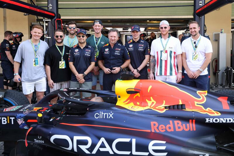Red Bull Racing's team principal Christian Horner, centre, driver Sergio Perez and Max Verstappen with England cricketers Ben Stokes, second right, Liam Livingstone, right, and others in Abu Dhabi. AFP