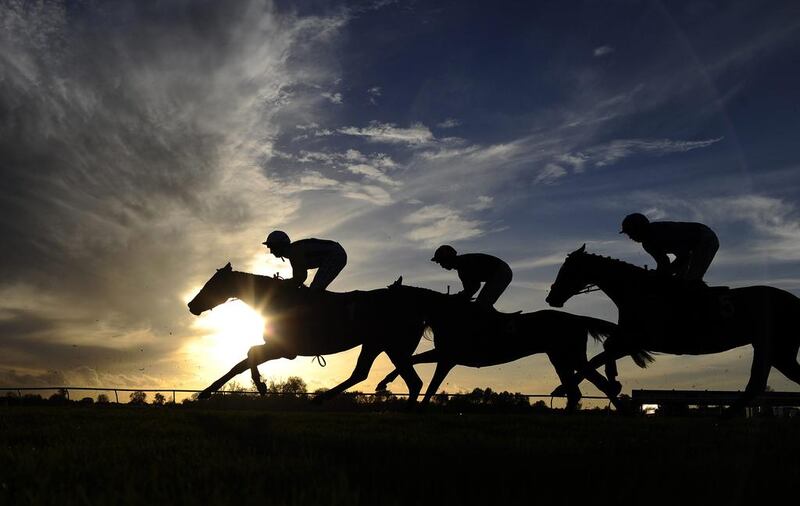 The sun begins to set at Huntingdon racecourse in Huntingdon, England. Alan Crowhurst / Getty Images