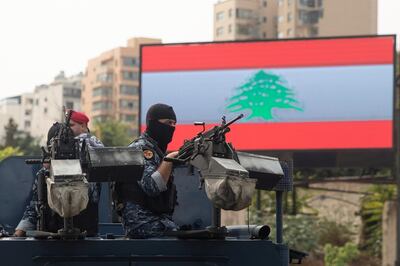 A riot police officer is seen on an armoured vehicle following a police operation to open a highway blocked by demonstrators during ongoing anti-government protests in downtown Beirut, Lebanon, October 26, 2019. REUTERS/Alkis Konstantinidis