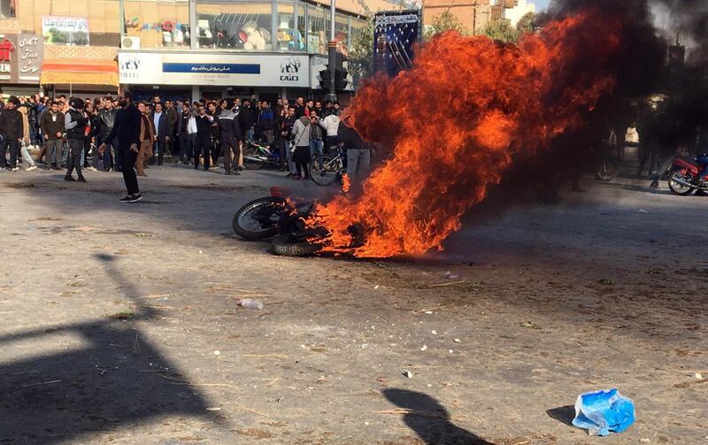 epa08002203 Iranian protesters clash in the streets following fuel price increase in the city of Isfahan, central Iran, 16 November 2019. Media reported that people protests in highways and in the streets after the government increased fuel price. Due to the ongoing economic crisis, the Iranian government has increased fuel prices up to 50 percent and the petrol price has become three times higher.  EPA/STR