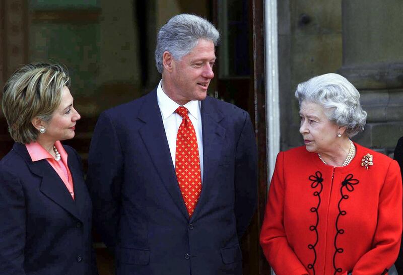 Clinton and his wife Hillary meet Queen Elizabeth at Buckingham Palace. AFP