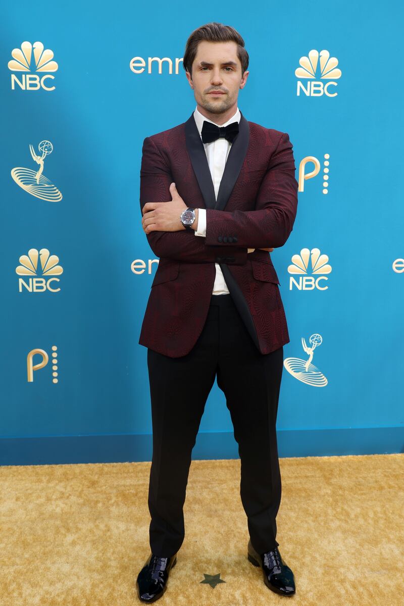Phil Dunster wearing a burgundy tuxedo. Getty Images 