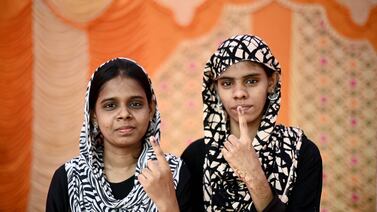 Women show their inked fingers after voting in Chennai, capital of Tamil Nadu state, in the first round of polling in India's seven-phase general election. AFP