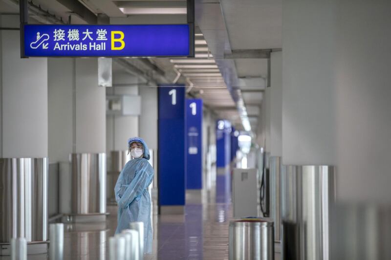 A worker wearing personal protective equipment (PPE) stands at a Covid-19 testing center dedicated for airport workers set-up at the Hong Kong International Airport in Hong Kong, China. The Asian financial hub has been attempting to curb a fourth wave of Covid-19 infections with targeted lockdowns that have seen authorities cordon off an area and restrict movement until residents receive negative results. Bloomberg