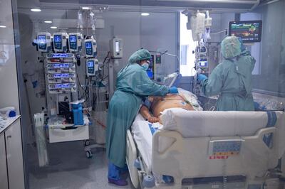 A Covid patient is treated in an ICU unit. AFP
