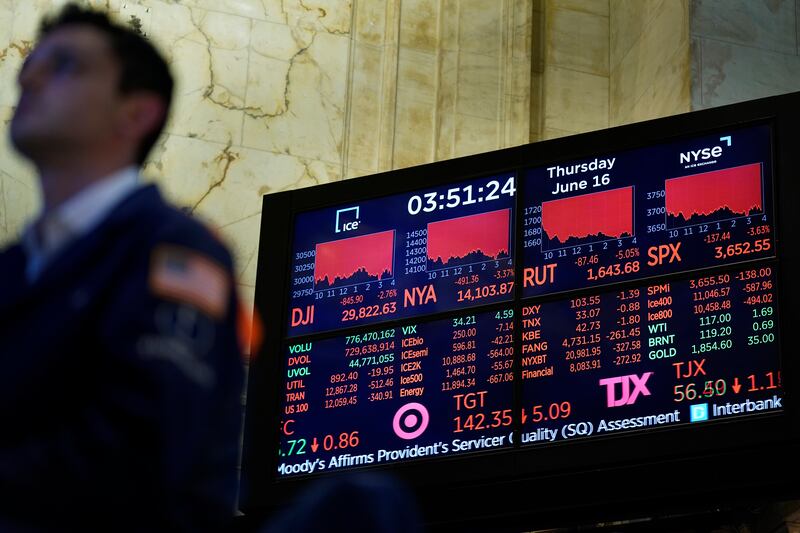 A trader on the floor of the New York Stock Exchange. Global market volatility continues to worry investors. AP