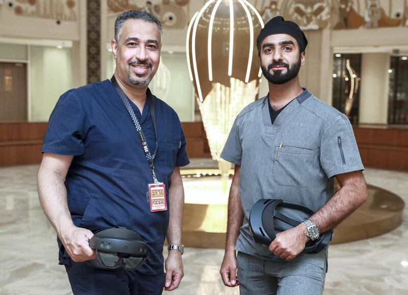 Abu Dhabi, United Arab Emirates, February 3, 2021.  Surgeons are trying out new holographic surgery technology.  (L-R) Dr. Rashed Al Shaeel, Consultant- Head of Orthopedics and Trauma at Burjeel Medical City and Dr. Jaber AlKhyeli, Consultant Orthopedic Surgeon at Burjeel Medical City with the HoloLens 2 mixed reality headset.
Victor Besa/The National.
Section:  NA
Reporter:  Nick Webster