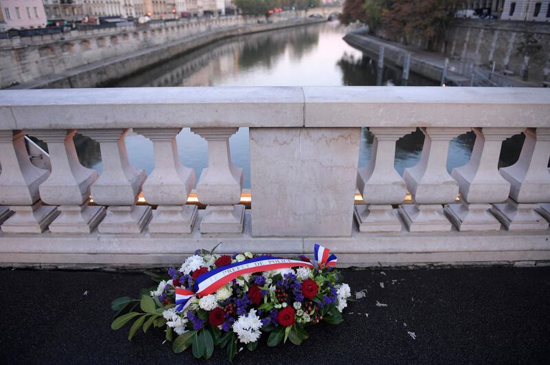 A wreath of flowers signed by Police Prefecture on the Saint Michel bridge in Paris during a ceremony to commemorate the brutal repression of the 1961 demonstration by Algerians. AFP