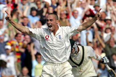 England's Simon Jones (C) celebrates after bowling Australia's Michael Clarke at Old Trafford cricket ground in Manchester, 15 August 2005 on the fifth day of the third Ashes Test. - The Series is currently drawn at 1-1. (Photo by ALESSANDRO ABBONIZIO / AFP)