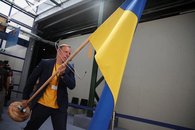 A Ukrainian flag is carried into the venue. Reuters