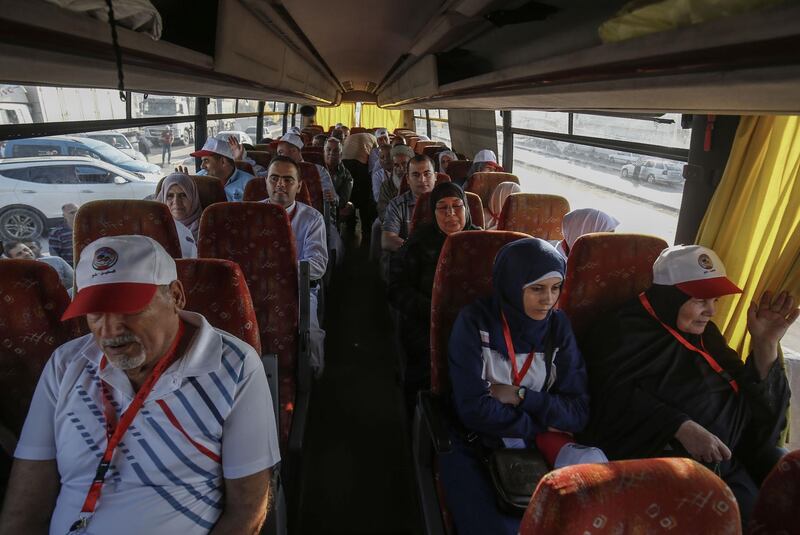 Palestinian Muslim pilgrims sit in a bus at the Rafah border crossing between the Gaza Strip and Egypt. AFP