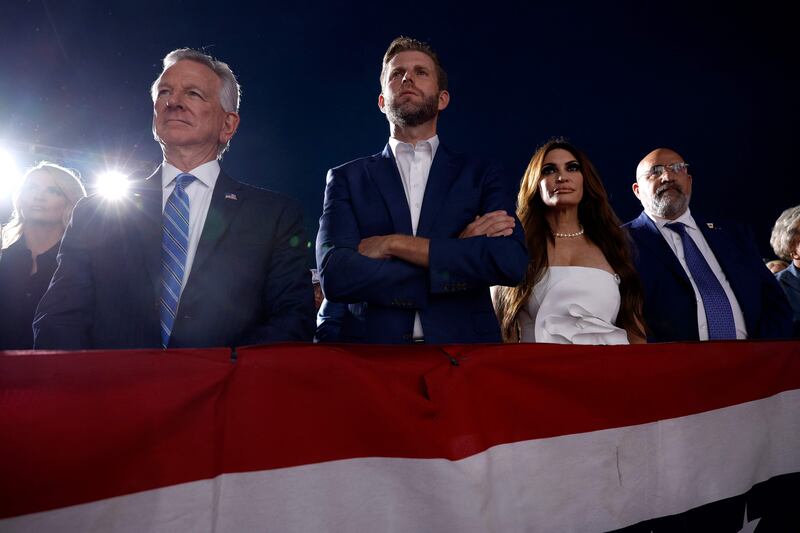 US Senator Tommy Tuberville, Mr Trump's son Eric and Donald Trump Jr's fiancee Kimberly Guilfoyle look on as the former president address supporters in New Jersey. AFP
