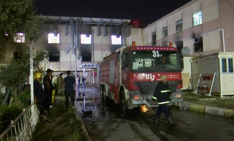 A firefighting vehicle arrives at the scene of a fire that erupted in a Baghdad hospital's intensive care unit for coronavirus patients. AP