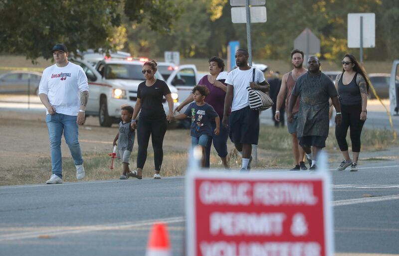 People leave the Gilroy Garlic Festival following a deadly shooting. AFP