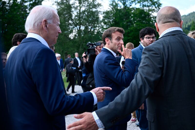 Mr Biden and Mr Macron.  AP 