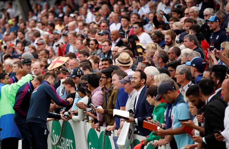 England celebrate winning the Cricket World Cup The Oval, London, Britain. England's Chris Woakes signs his autograph for fans during the celebrations. Reuters